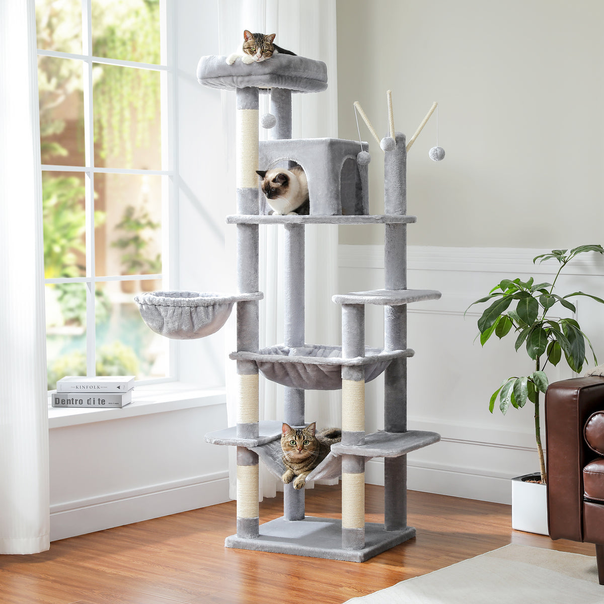 Light grey Mid-Rise cat tree with tabby on the top perch, pointed cat at condo and another tabby in the lower sling