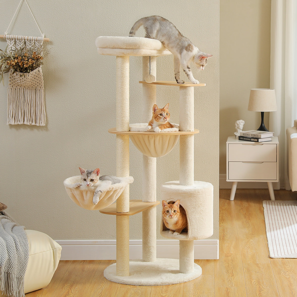 Modern cat tree 135cm with plush top perch, wood platforms and sisal posts, four kittens around it in a living room
