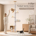 Five-tier wood floor-to-ceiling cat tree with white cushions, orange cat inside the top transparent acrylic capsule