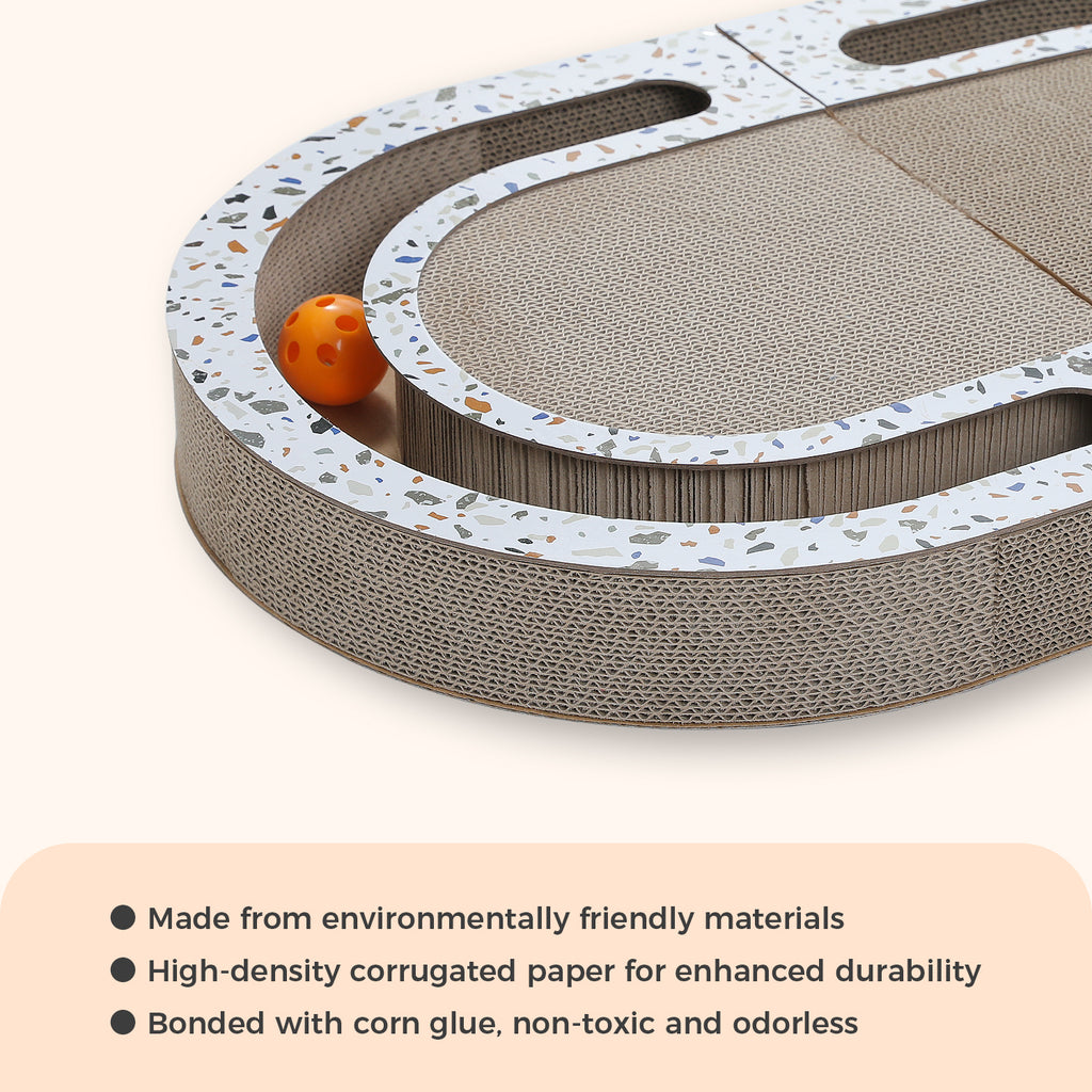 Clean studio shot of an oval high-density corrugated cardboard scratcher with an orange track ball and eco text panel