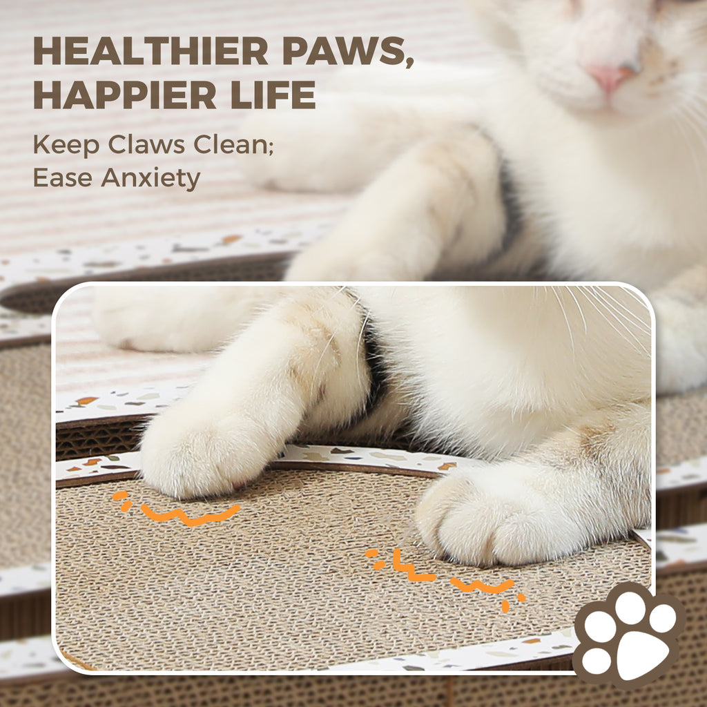 White and ginger cat lounging on a cardboard scratching pad beside a close-up inset of paws kneading the surface