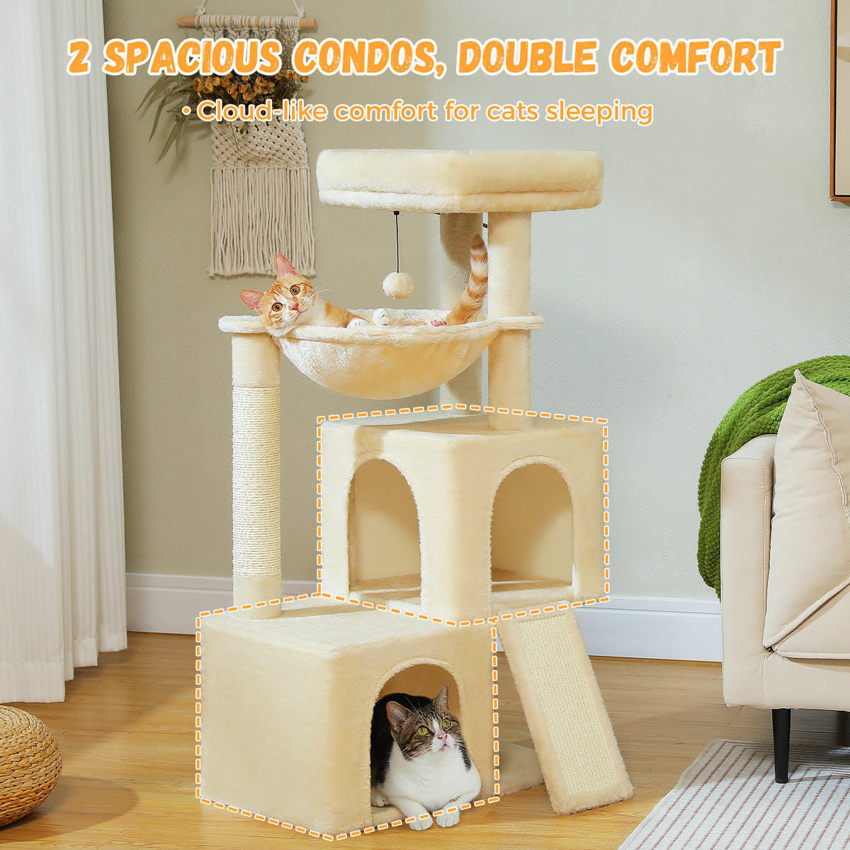 Beige plush cat tree with twin arched condos and a hanging hammock in a green living room, ginger cat napping inside