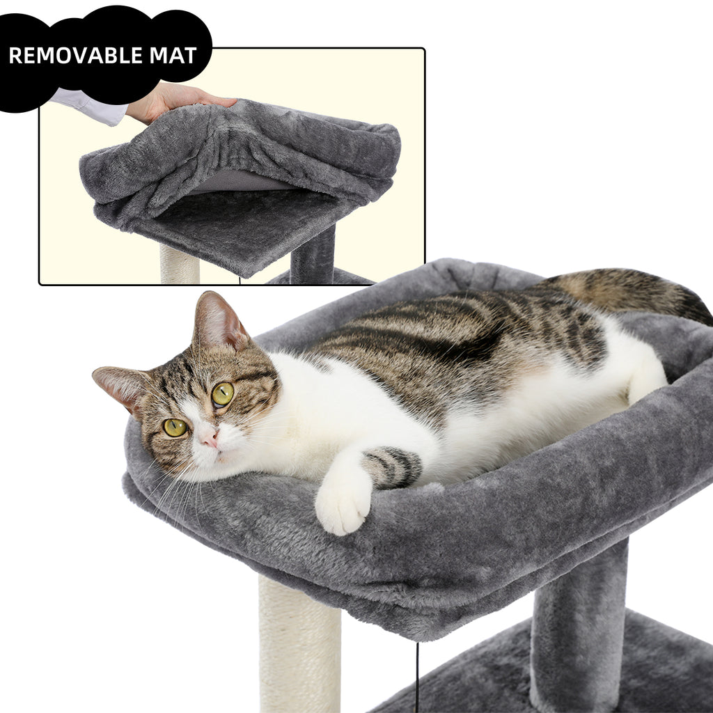 Tabby and white cat lounges on the removable top mat of the grey compact tree, inset shows the pad lifted