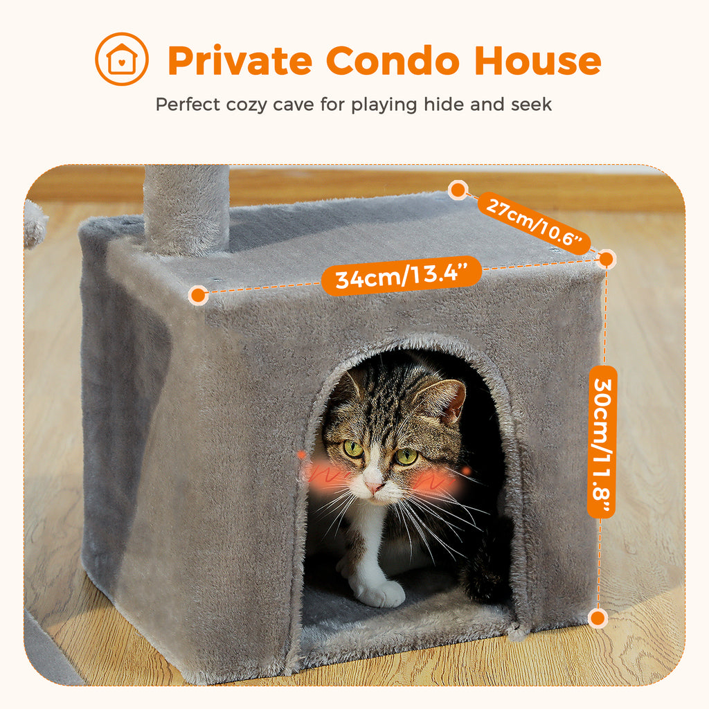 Brown and white tabby rests inside the arched grey condo of the 73cm cat tree with measurement labels