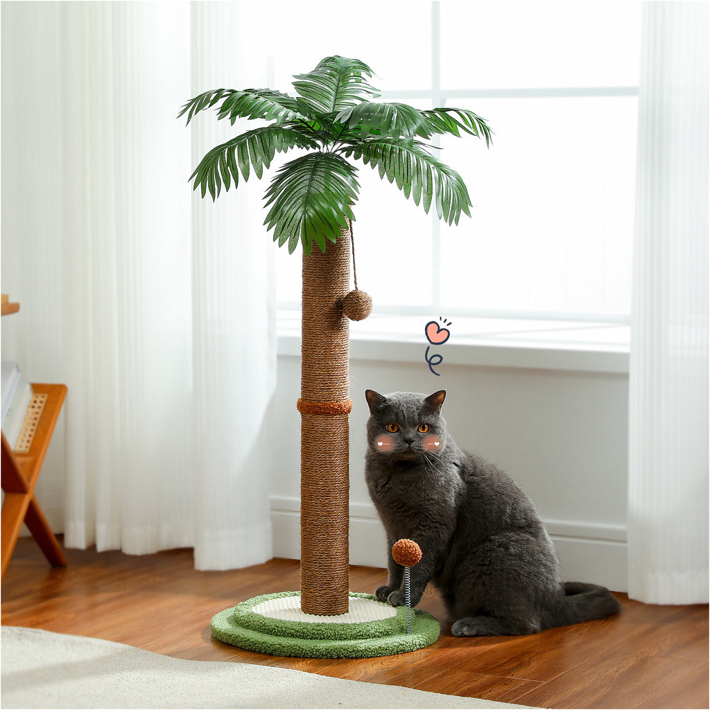 Palm tree cat scratching post 85cm with sisal trunk, grey cat sitting beside its green base in a bright room