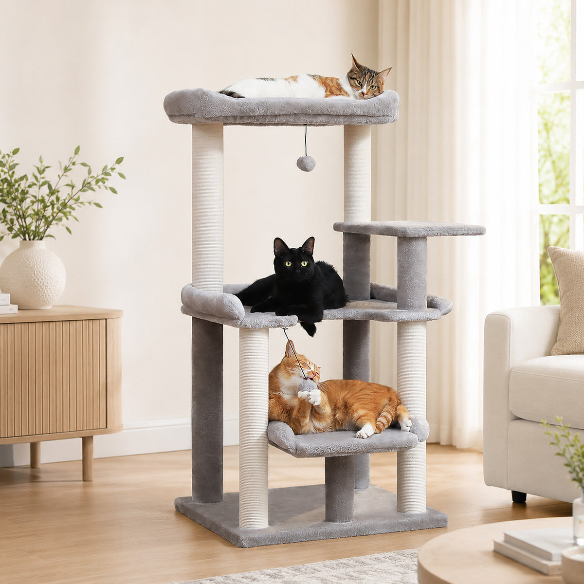 Grey 110cm cat tree in a bright room, calico on the top perch and black cat lounging on the middle level