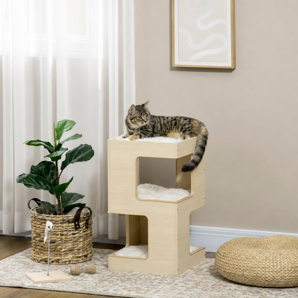 Grey tabby cat resting on the top perch of a three-tier light oak cat house in a bright living room