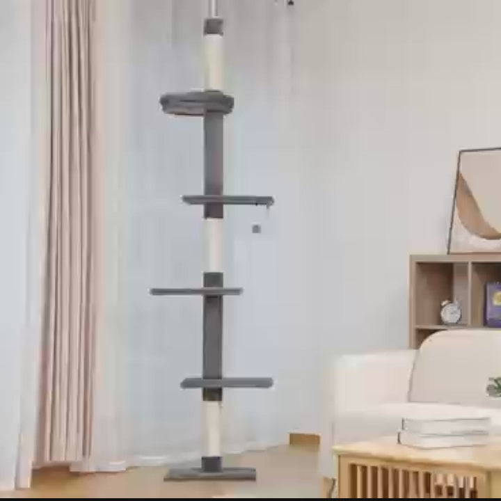 Video still of the slim charcoal grey floor-to-ceiling cat tower with three platforms and a circular top perch